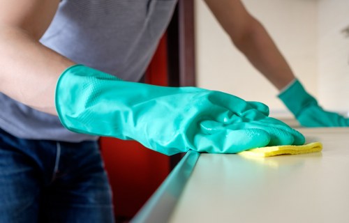 Detailed inspection of fabrics in a Westminster dry cleaning process