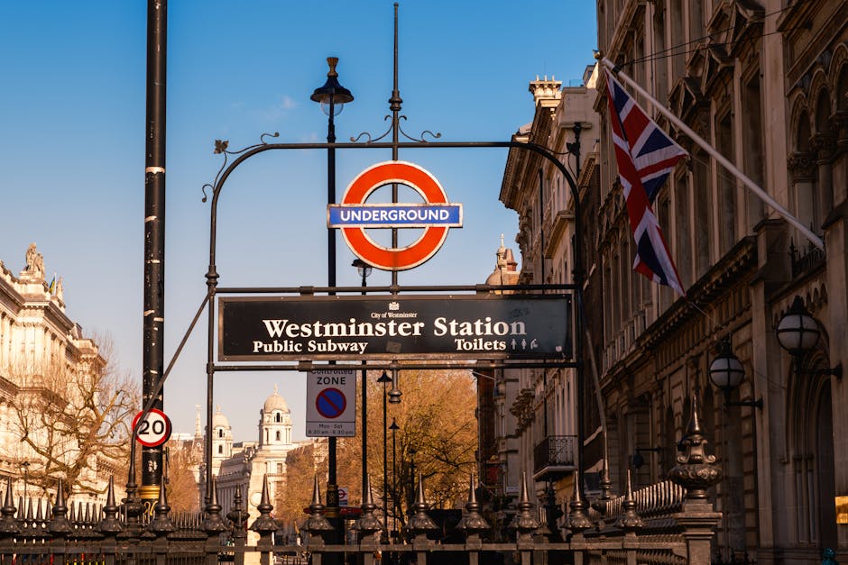 Exterior view of the historic Covent Garden Station building in Westminster SW1, featuring red brick and stone construction with large arched windows and decorative detailing. The signage indicates th
